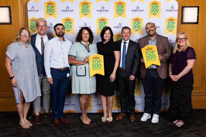 Photo of JA North Staff members posing at the Top 200 Workplaces event