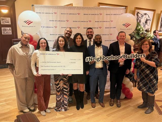A group of Junior Achievement North staff and Bank of America representatives as they award JA North as a Neighborhood Builder for 2025.