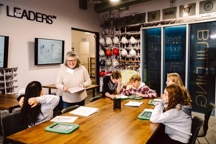 A group of junior high students during a JA Finance Park simulation in our learning labs.